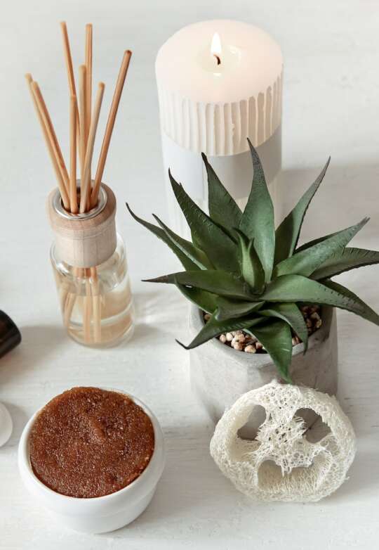 Spa composition with aroma sticks, aroma oil and body care products.